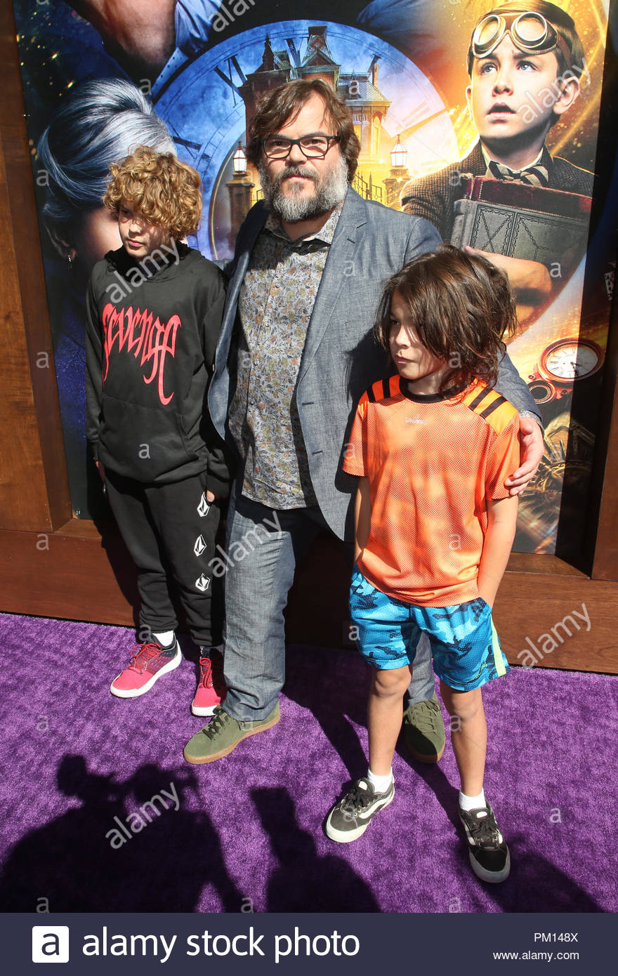 Thomas with his elder brother and father in a movie premier.
